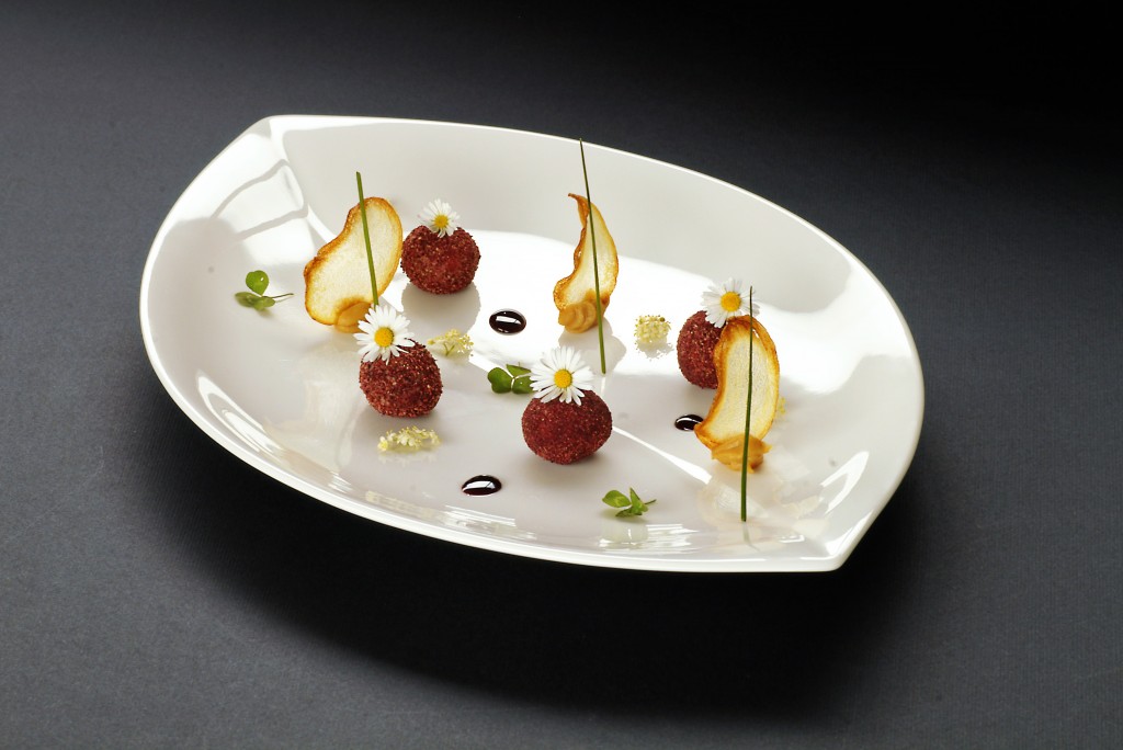 Hot smoked Bonito pate in a beet powder,crispy new potato,pommegranate reduction
